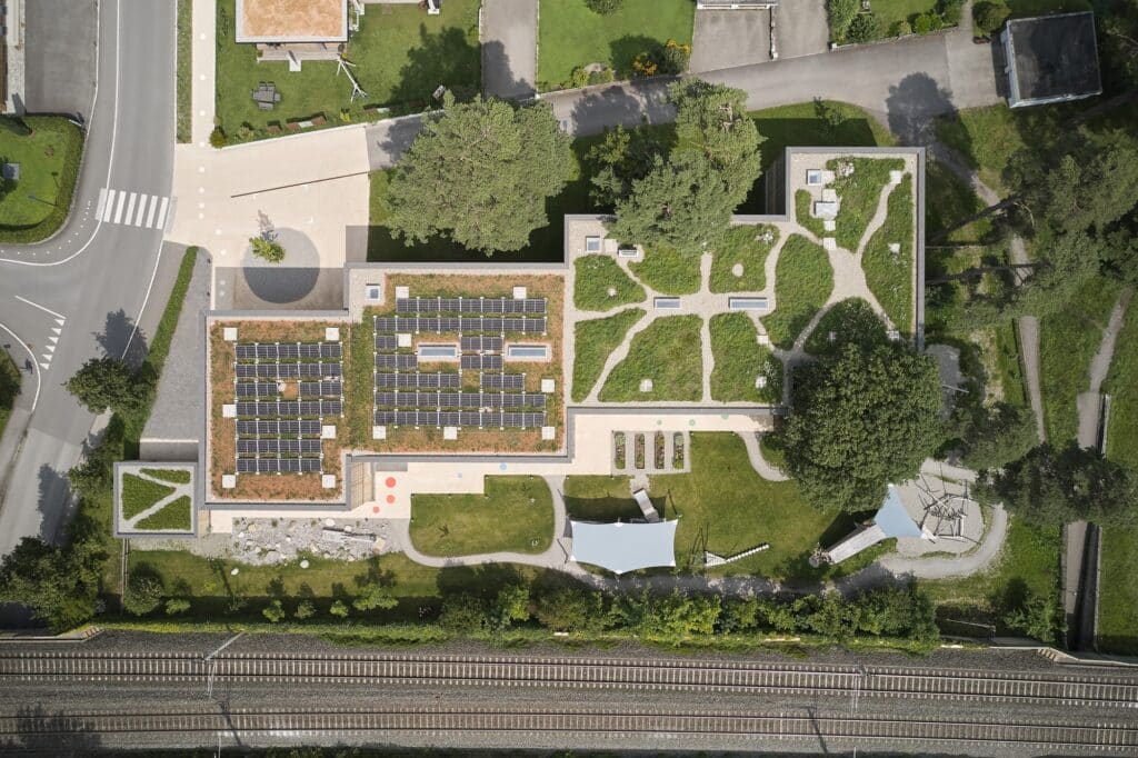 Exterior view of Allesamt Family Center with wooden fa&ccedil;ade near Nenzing train station