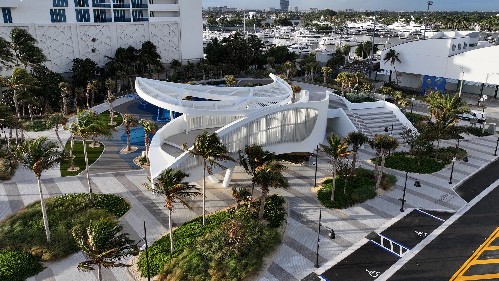 DC Alexander Park in Fort Lauderdale integrates coastal resilience, elevated dunes, hammock forest, and sustainable urban infrastructure to manage floods, enhance public green space, and create interactive recreational areas.
