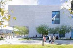 Exterior view of the Ismaili Center Houston, showing stone formations and architectural details inspired by Islamic heritage.
