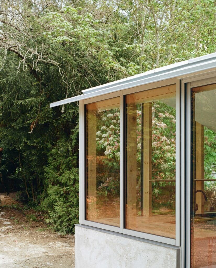 View of the original 1980s house structure with semi-buried ground floor and living spaces above