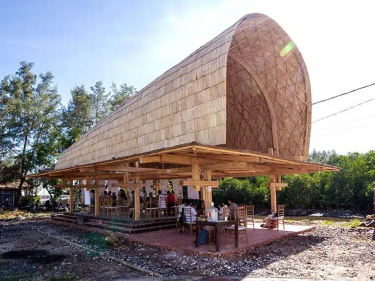 BaleBio pavilion viewed from Mertasari Beach, highlighting its bamboo barrel-vaulted roof