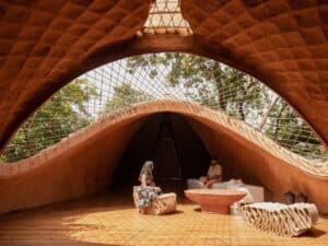 Overview of The Bridge House surrounded by dense forest in Karjat, India
