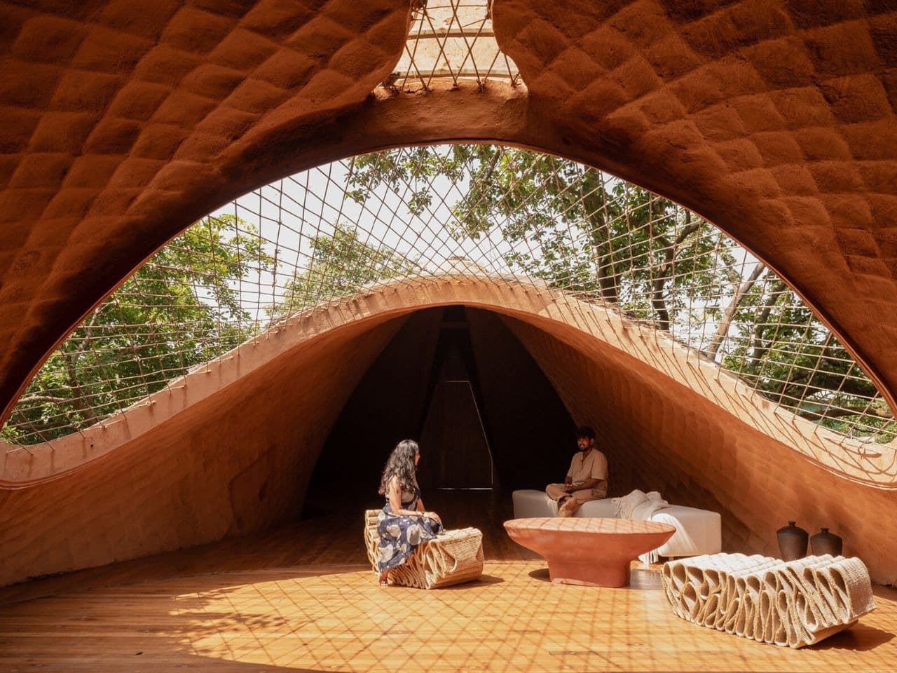 Overview of The Bridge House surrounded by dense forest in Karjat, India