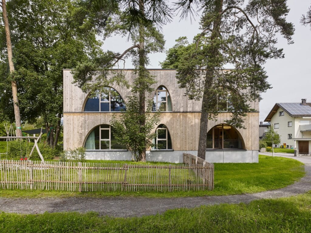 Exterior view of Allesamt Family Center with wooden fa&ccedil;ade near Nenzing train station