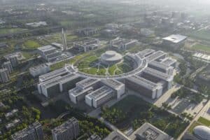 Aerial view of West Lake University campus showing interconnected academic and residential buildings surrounded by greenery.