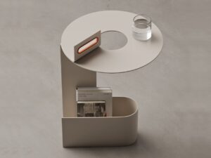 Top view of TWIST side table showing circular opening, ergonomic orange handle, and integrated storage base.
