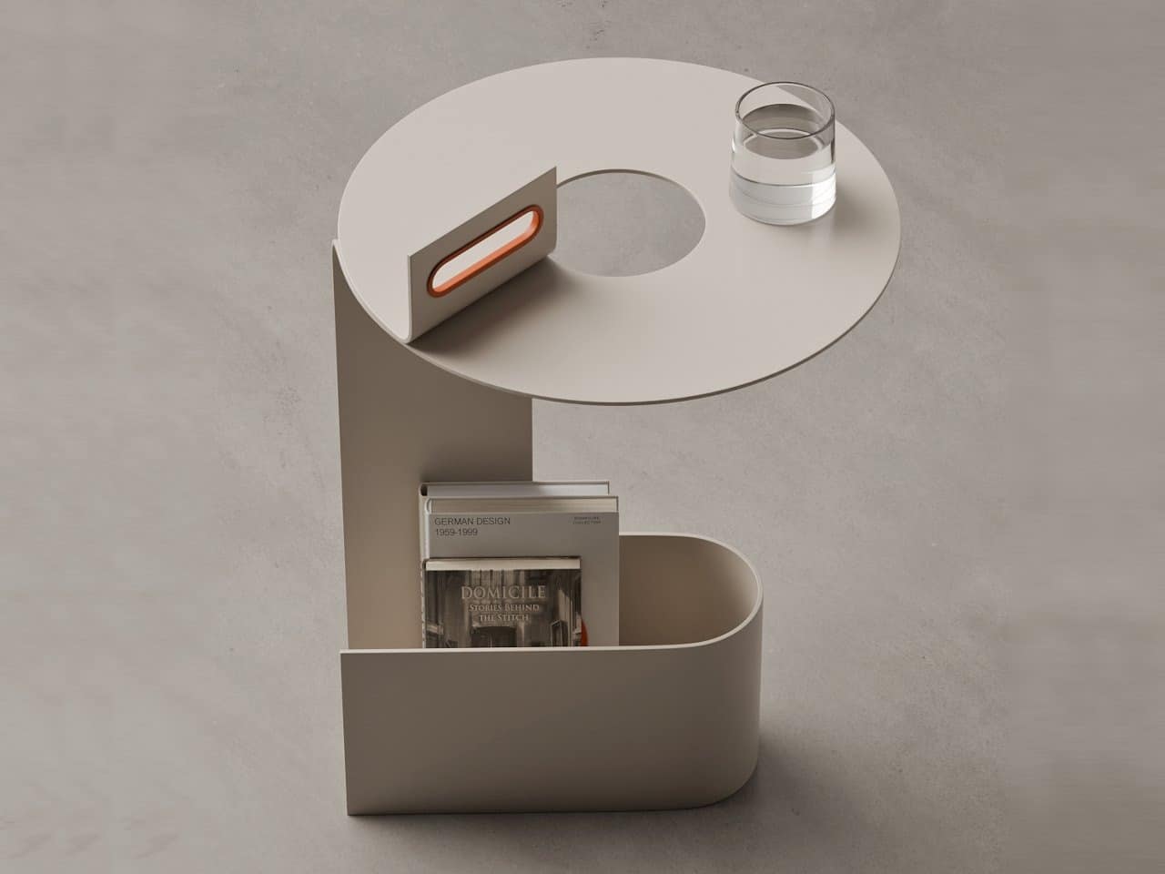 Top view of TWIST side table showing circular opening, ergonomic orange handle, and integrated storage base.