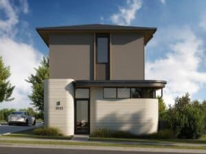 Front view of a house with 3D-printed lower floor and traditional upper floor