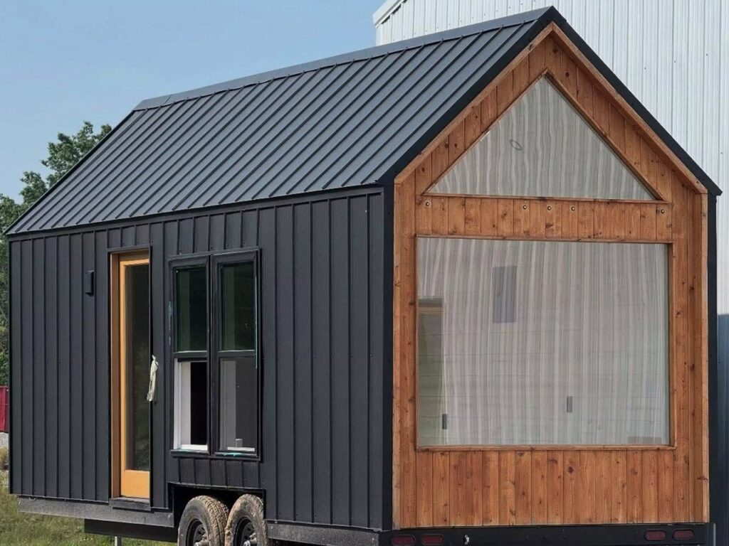 Exterior view of Weekender house with large windows and metal cladding