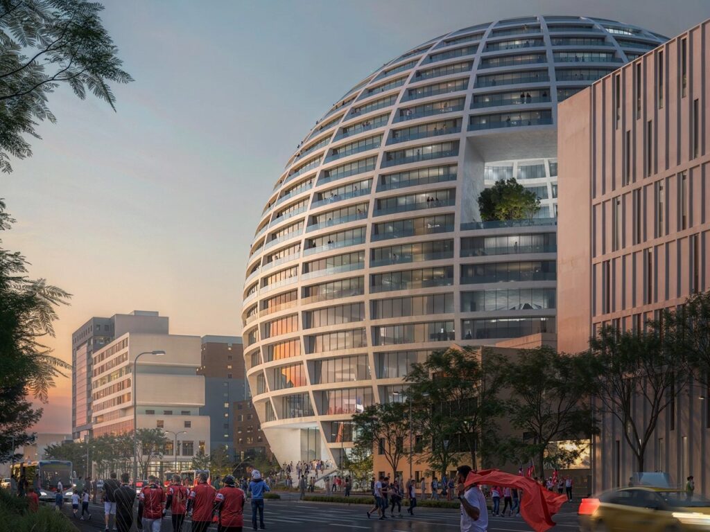 Exterior view of MVRDV Grand Hall sphere illuminated above Tirana, showing its spherical design and urban context