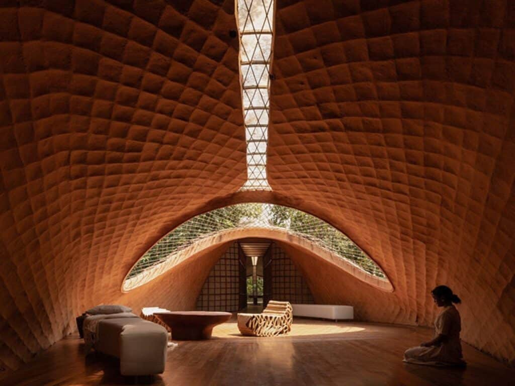 Overview of The Bridge House surrounded by dense forest in Karjat, India