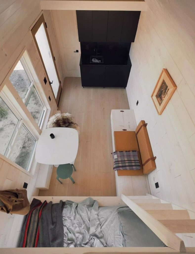 Exterior view of Weekender house with large windows and metal cladding