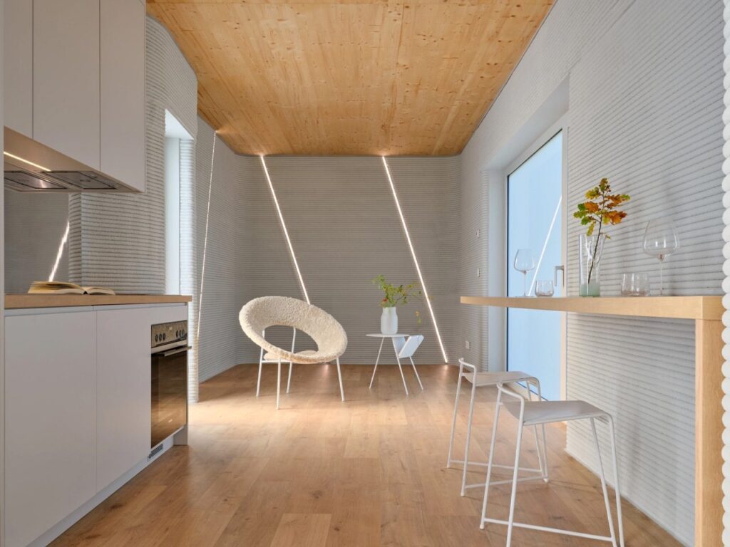 Tiny House Lux in Niederanven, Luxembourg, 3D-printed concrete residential building with sustainable design, compact urban layout, and energy-efficient features.