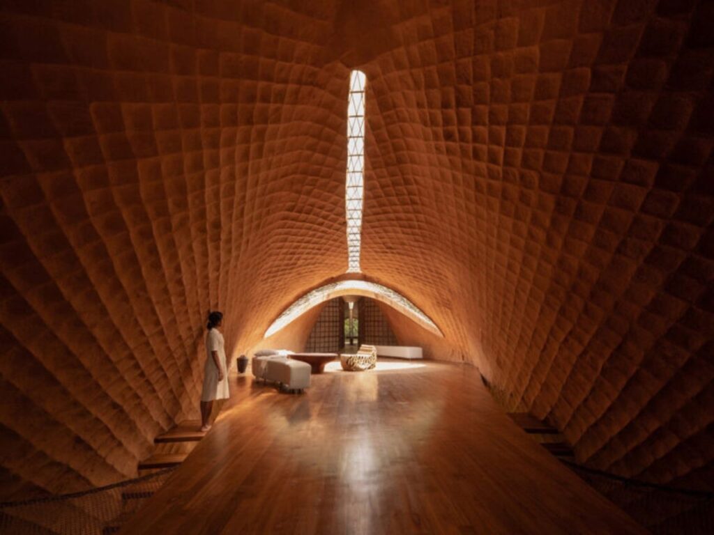 Overview of The Bridge House surrounded by dense forest in Karjat, India