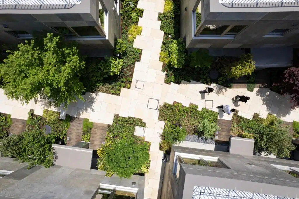 Overview of Nishi-Ogikubo residential cluster showing three-story terraced houses and narrow garden paths.