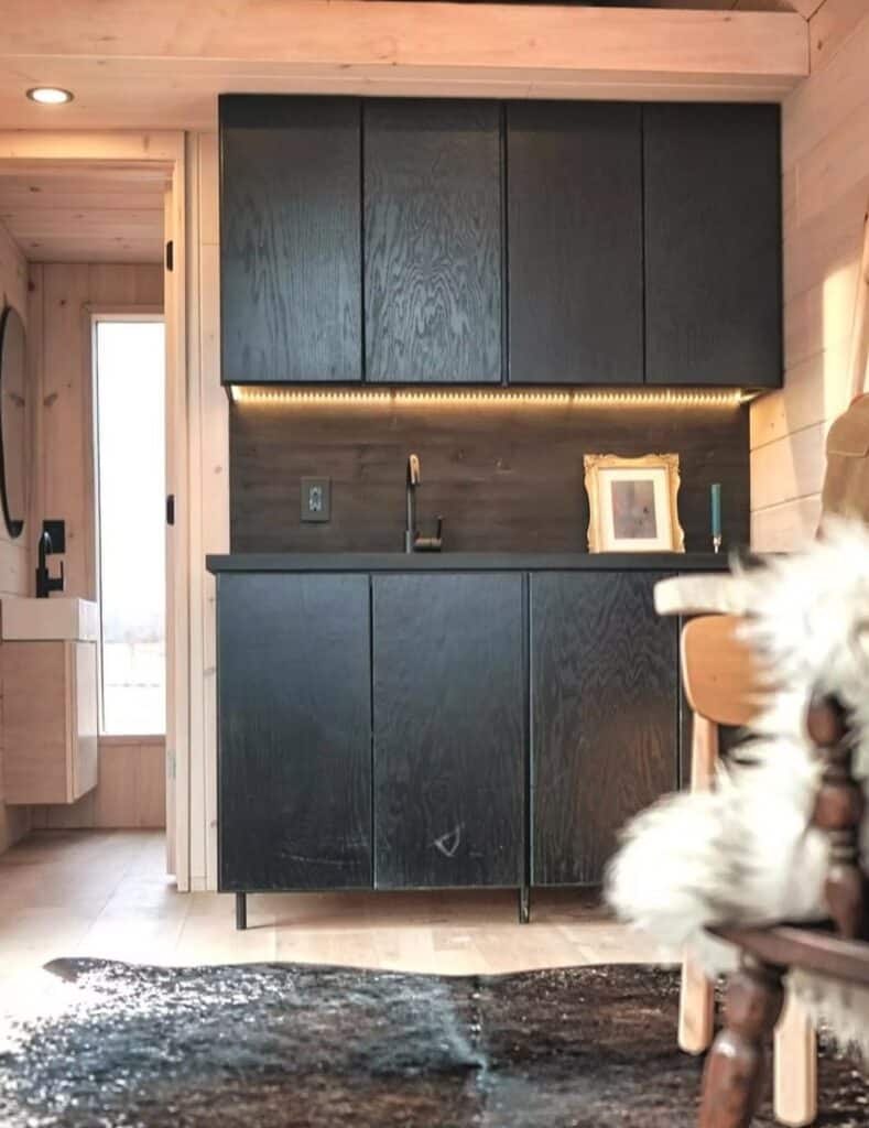 Exterior view of Weekender house with large windows and metal cladding