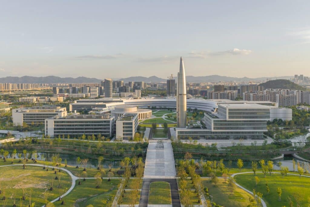 Aerial view of West Lake University campus showing interconnected academic and residential buildings surrounded by greenery.