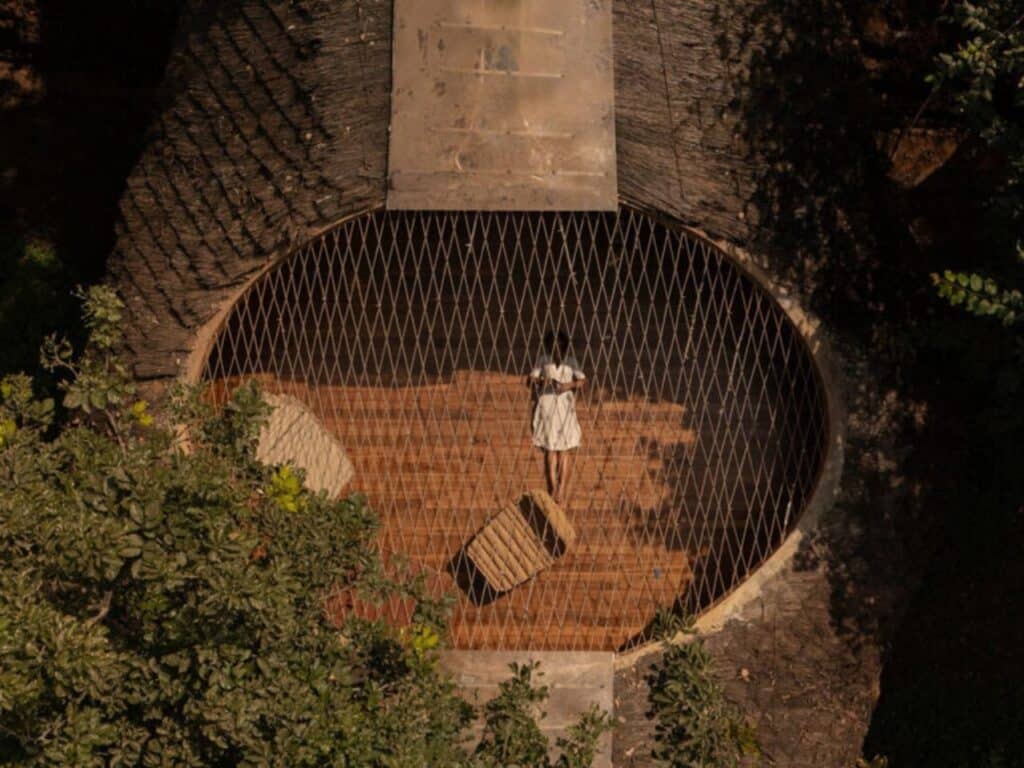 Overview of The Bridge House surrounded by dense forest in Karjat, India