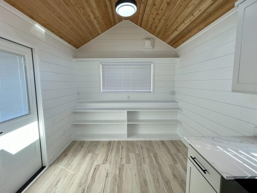 Open-plan living area inside New Chapter, showing furniture layout flexibility and optimized use of limited space for daily activities.