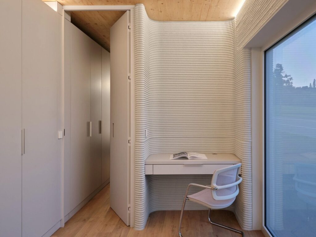 Tiny House Lux in Niederanven, Luxembourg, 3D-printed concrete residential building with sustainable design, compact urban layout, and energy-efficient features.