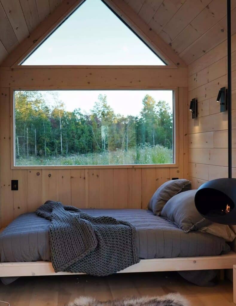 Exterior view of Weekender house with large windows and metal cladding