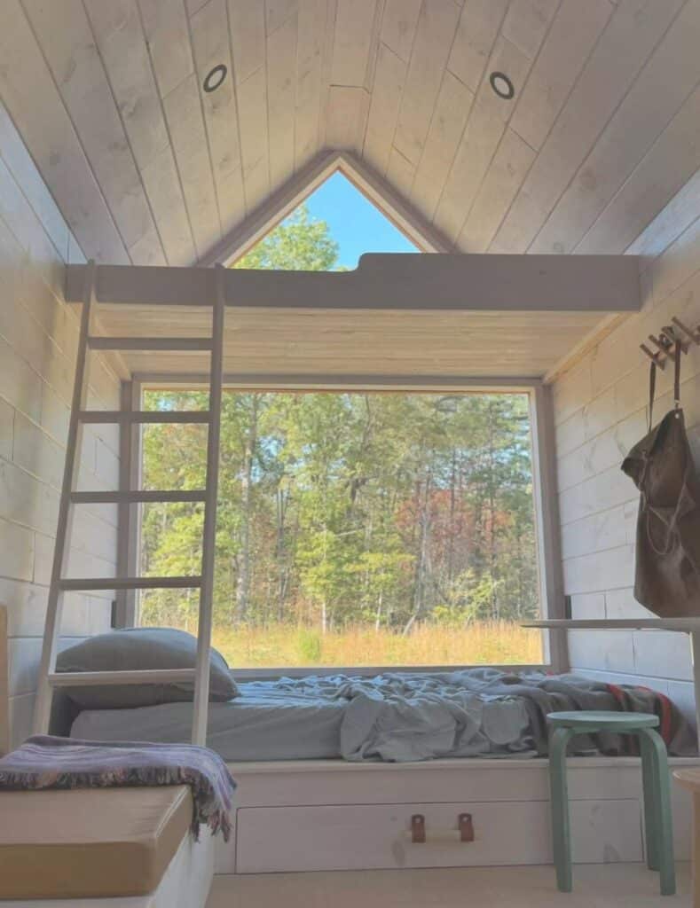 Exterior view of Weekender house with large windows and metal cladding