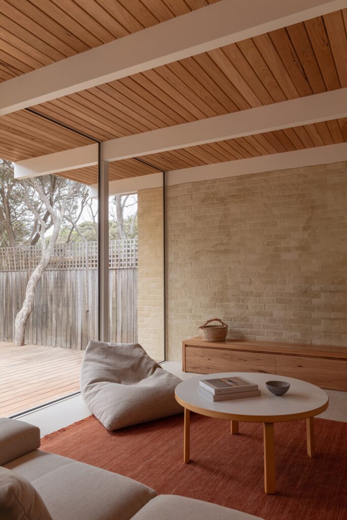 Open living spaces in Anglesea house flowing seamlessly towards the garden, enhancing indoor-outdoor connection.