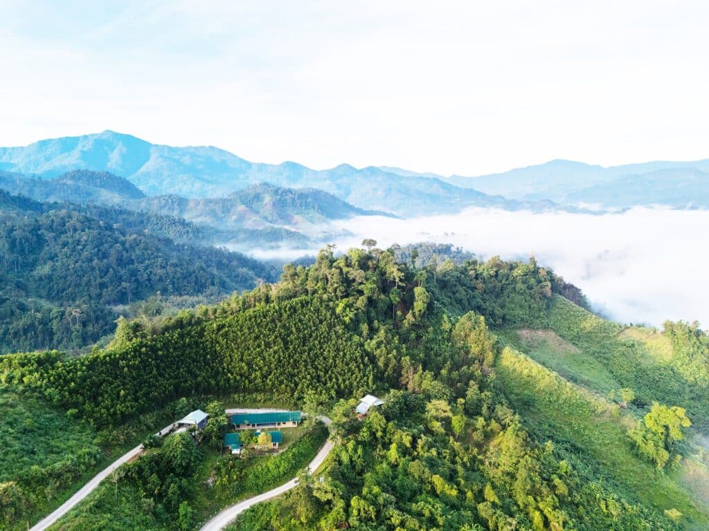 Nuoc Ui School located in the remote mountainous area of Tra My, highlighting rugged terrain and natural surroundings.
