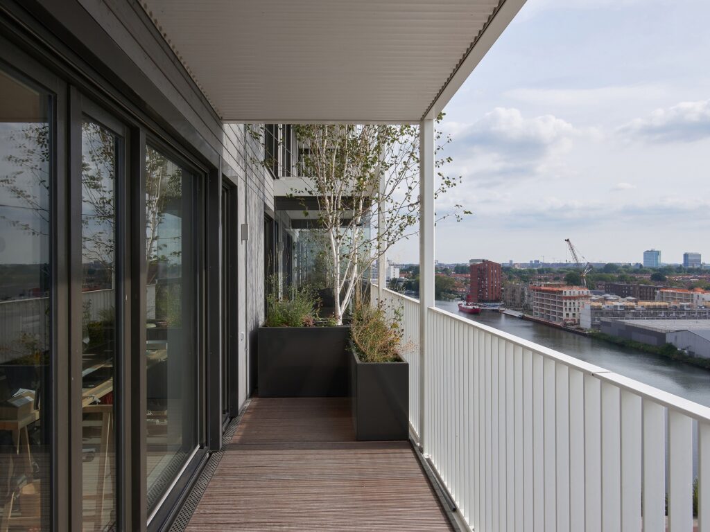 Stories project building in Amsterdam with cross-laminated timber fa&ccedil;ade and vertical greenery