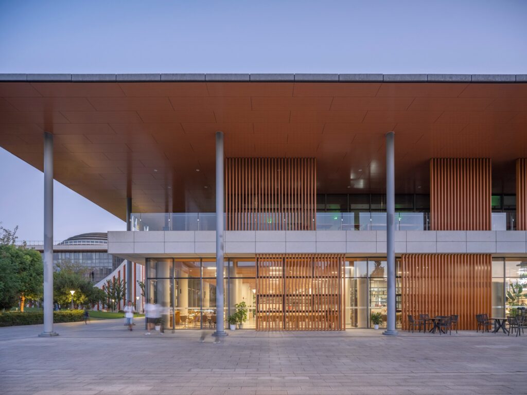 West Lake University campus integrating academic, residential, and social spaces through interconnected buildings, circular loops, and landscaped areas, creating a modern educational environment.