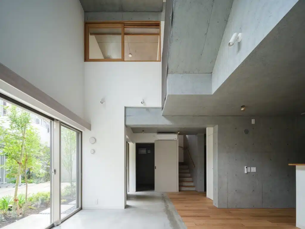 Overview of Nishi-Ogikubo residential cluster showing three-story terraced houses and narrow garden paths.