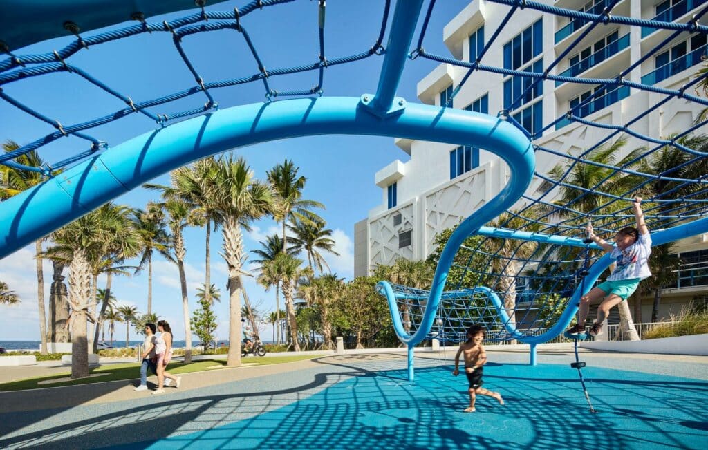 DC Alexander Park in Fort Lauderdale integrates coastal resilience, elevated dunes, hammock forest, and sustainable urban infrastructure to manage floods, enhance public green space, and create interactive recreational areas.