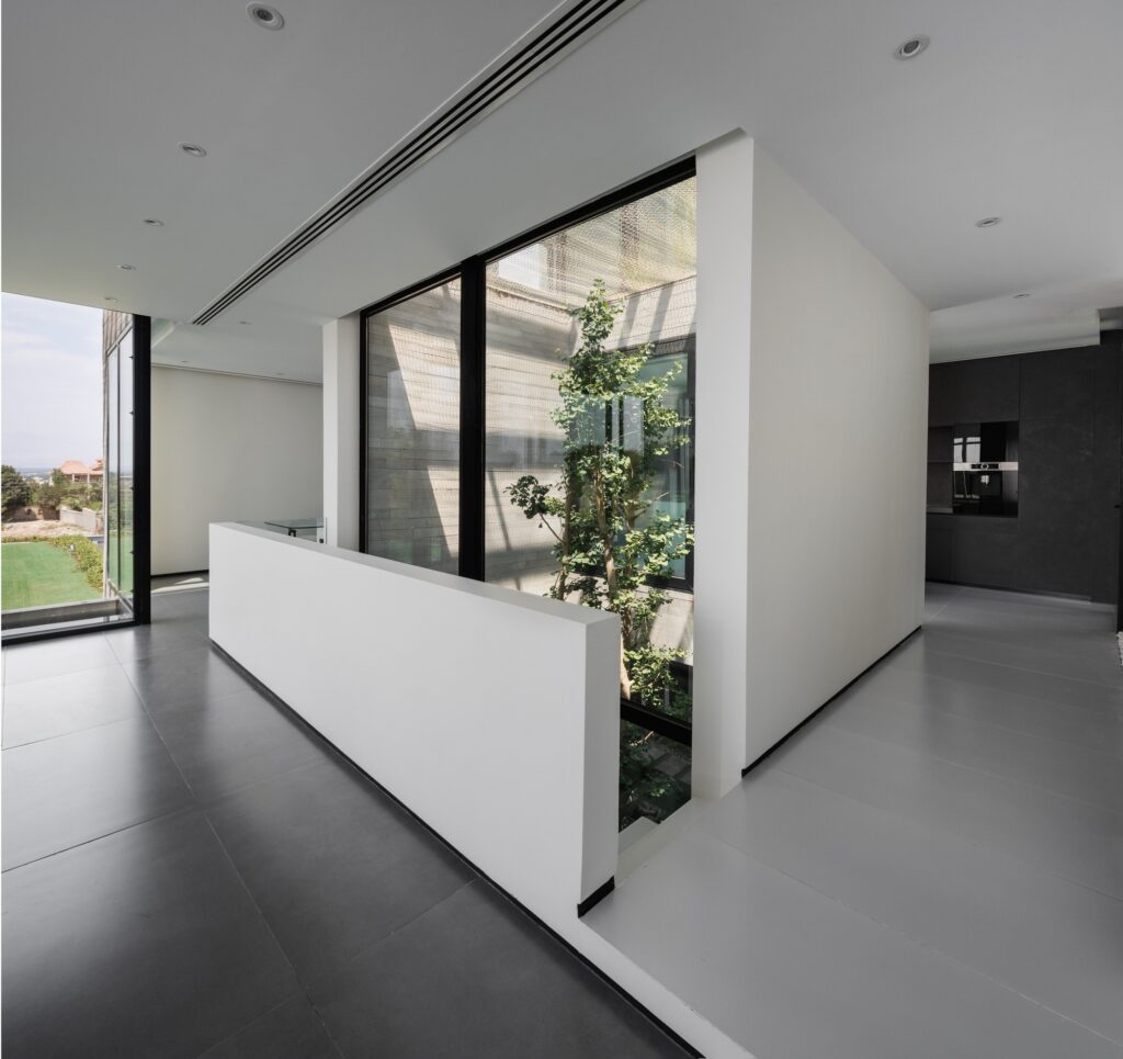 Villa 13 showcasing spatial interaction between open, semi-open, and enclosed areas, central green courtyard, sunlight orientation, and layered shading strategies enhancing interior and exterior experience