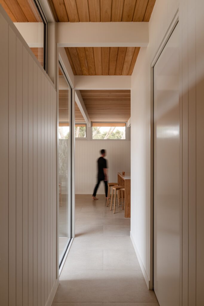 Open living spaces in Anglesea house flowing seamlessly towards the garden, enhancing indoor-outdoor connection.