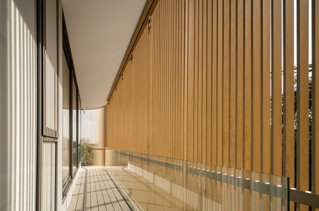 Exterior view of W House II showing the elevated single-story structure and its integration with the surrounding natural landscape.