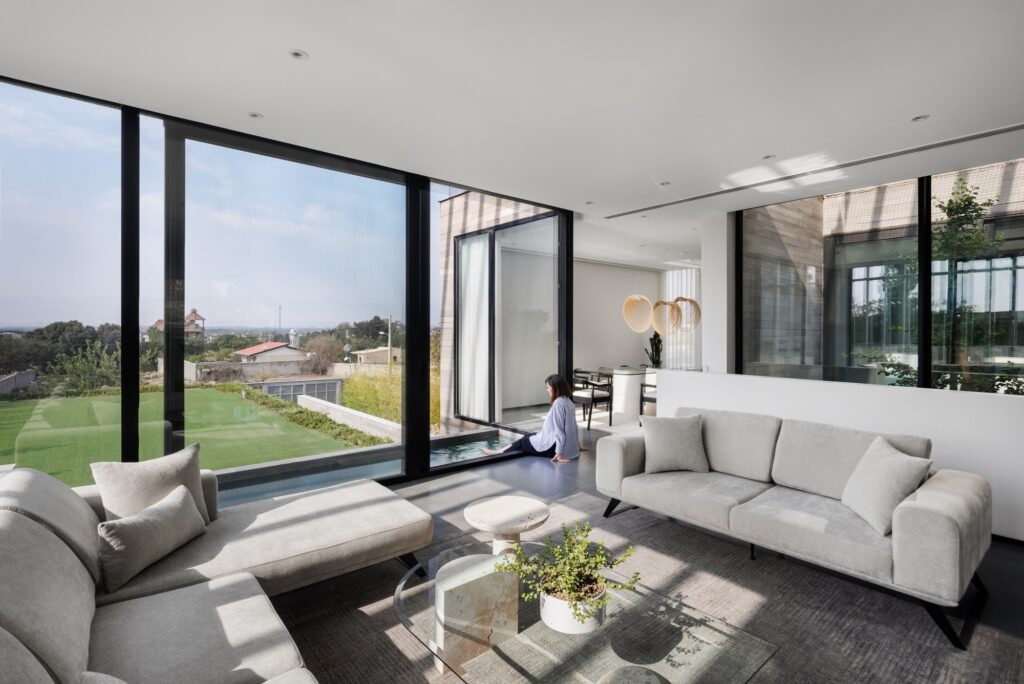 Villa 13 showcasing spatial interaction between open, semi-open, and enclosed areas, central green courtyard, sunlight orientation, and layered shading strategies enhancing interior and exterior experience