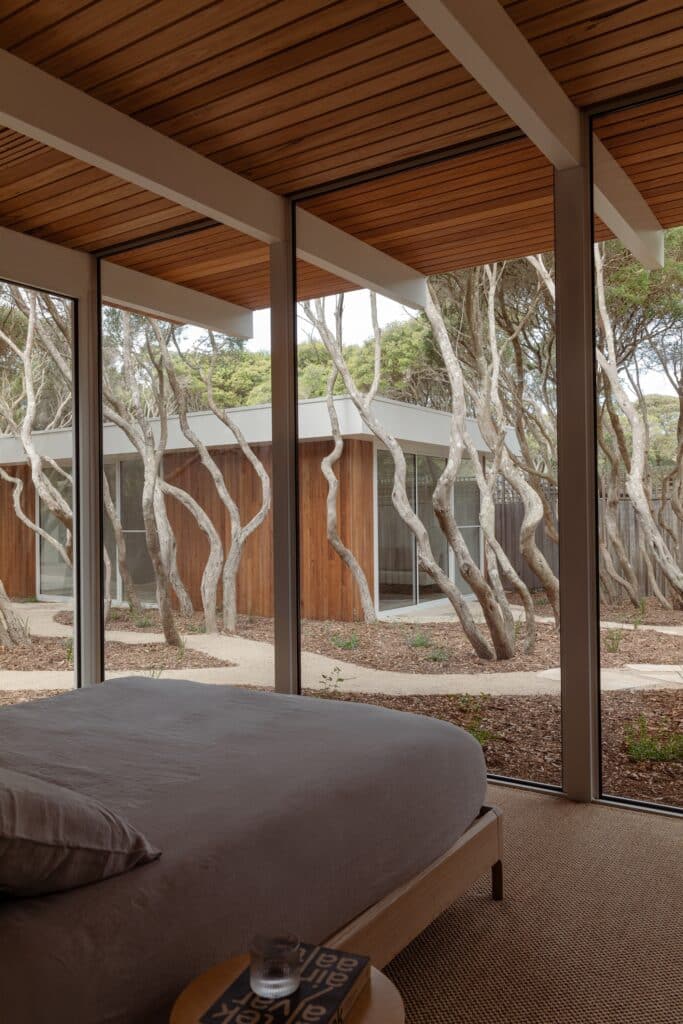 Open living spaces in Anglesea house flowing seamlessly towards the garden, enhancing indoor-outdoor connection.