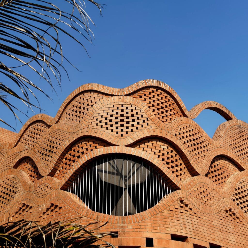 Maratha Sardar heritage house integrating traditional 'Wada' architecture with modern design, sustainable features, and self-sufficient living spaces.