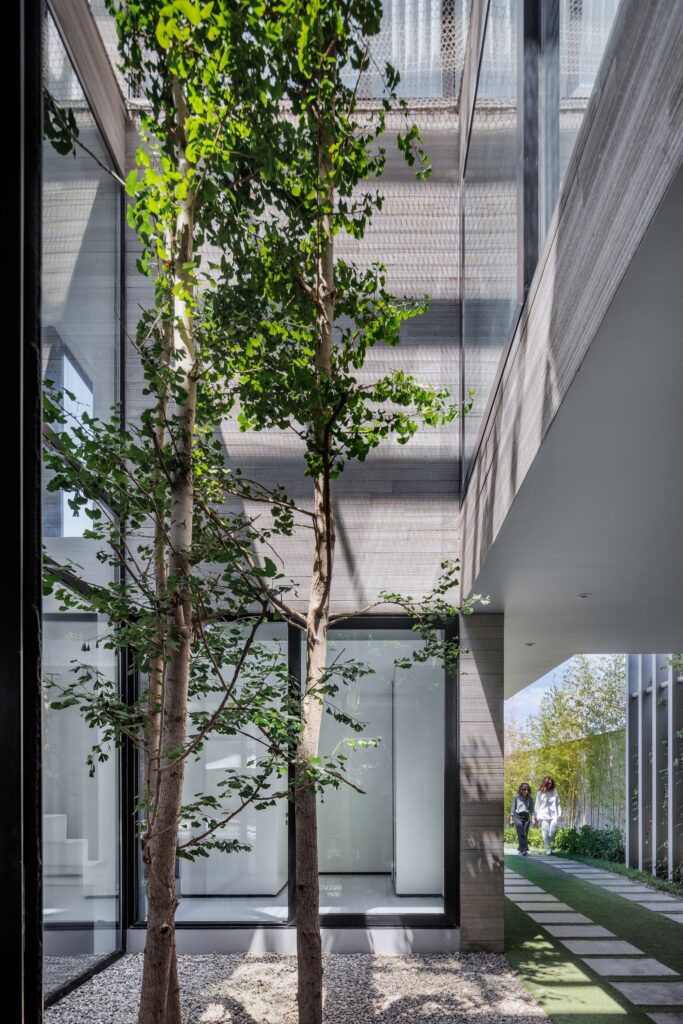 Villa 13 showcasing spatial interaction between open, semi-open, and enclosed areas, central green courtyard, sunlight orientation, and layered shading strategies enhancing interior and exterior experience