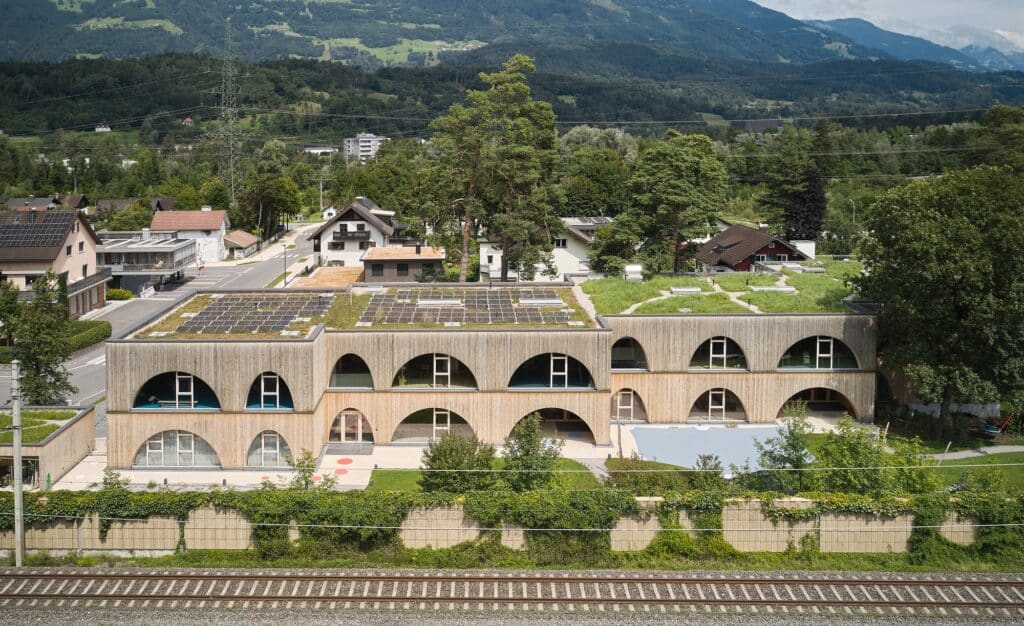 Exterior view of Allesamt Family Center with wooden fa&ccedil;ade near Nenzing train station
