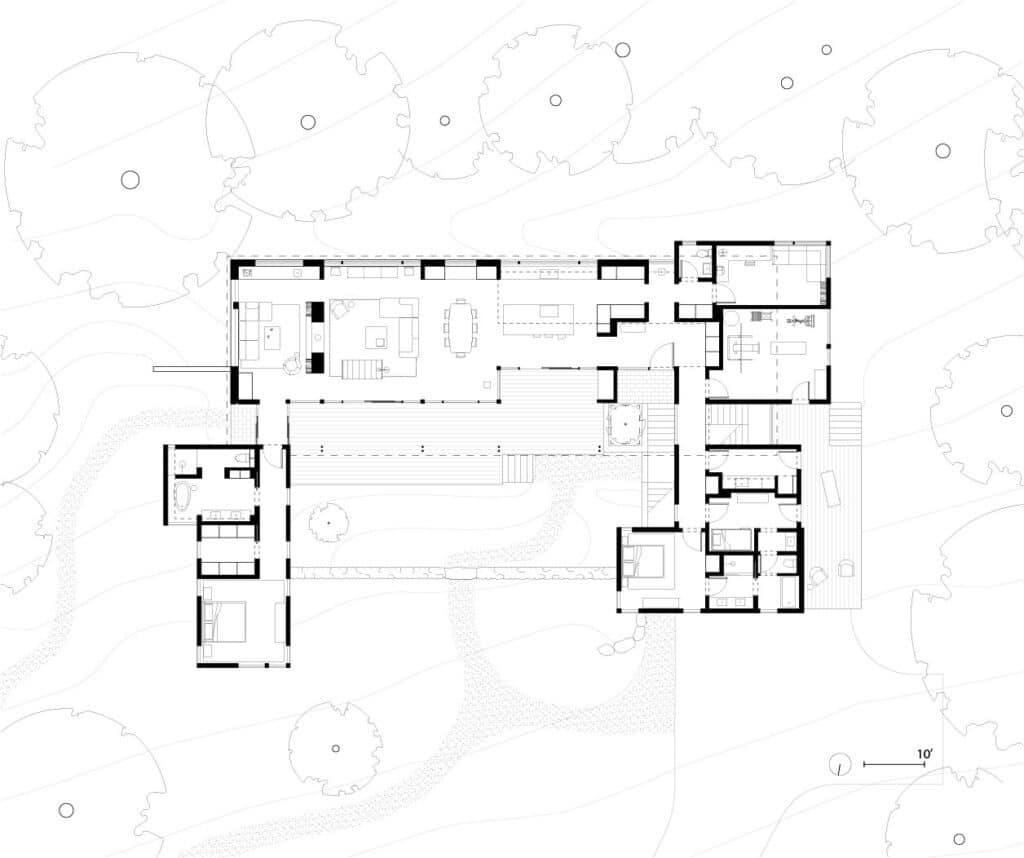 Exterior view of the Forest House nestled on a wooded slope overlooking the Connecticut River