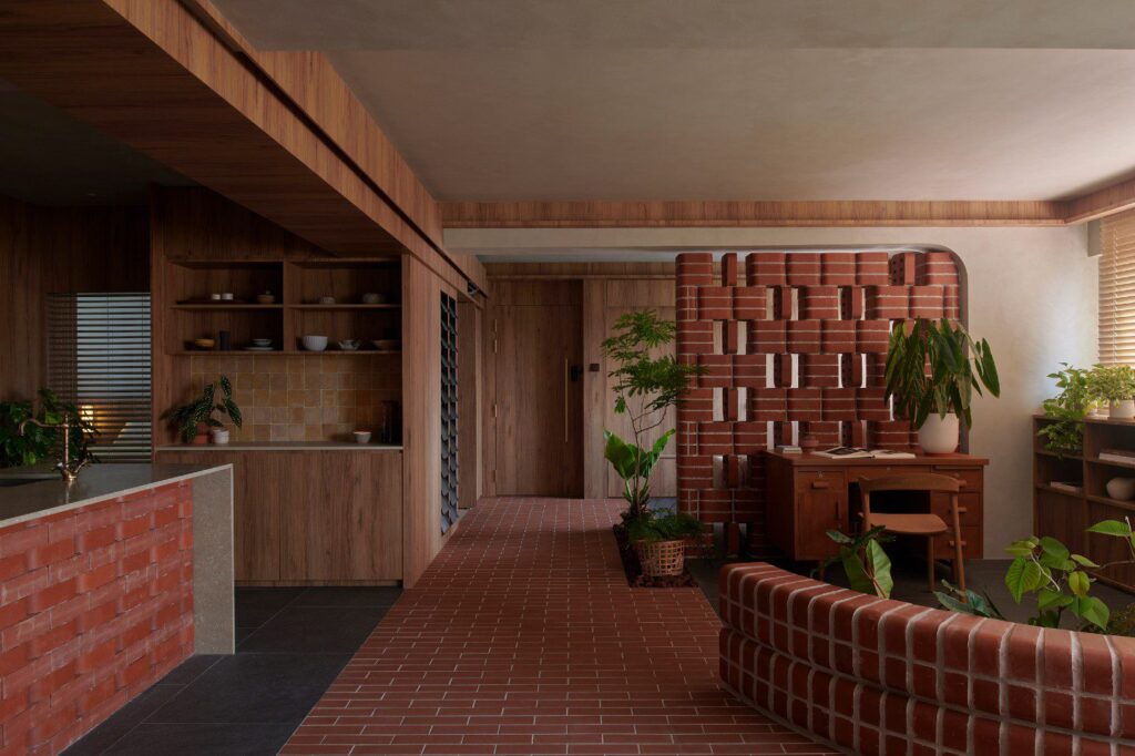 Use of double bullnose bricks in a Singapore flat to integrate nature and living space