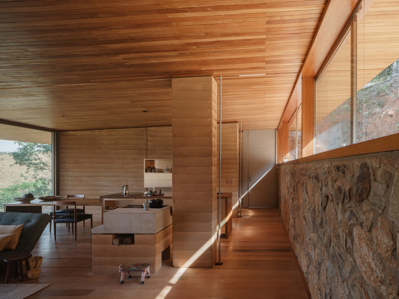 Compressed earth wall in the Piracaia Eco-Village houses, showing the traditional construction technique.