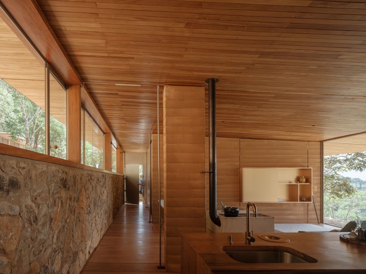 Compressed earth wall in the Piracaia Eco-Village houses, showing the traditional construction technique.