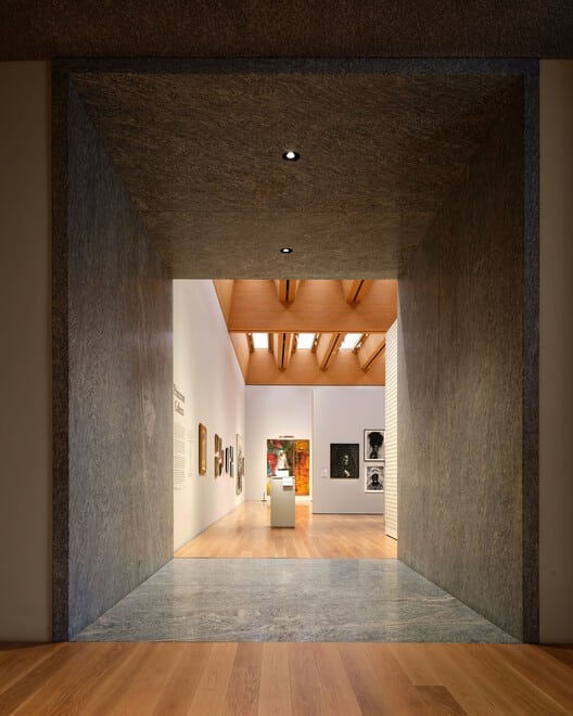 Interior view of Princeton University Art Museum showcasing stone walls, natural light, and geometric design reflecting contemporary materiality