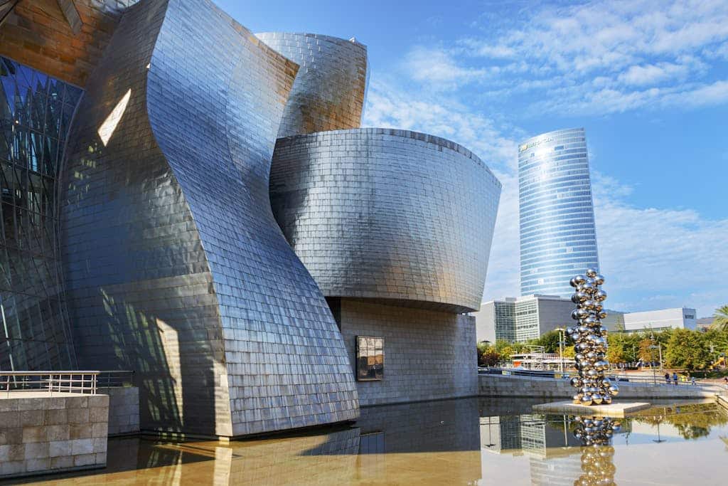 Stunning view of Guggenheim Museum in Bilbao under a clear blue sky.