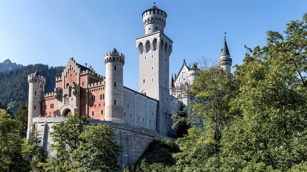 Stunning view of Neuschwanstein Castle set in Bavaria's picturesque landscape.