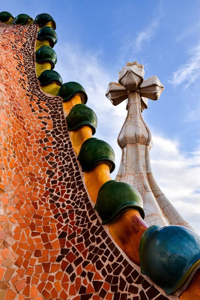 Vibrant mosaic detail from Gaudi's Casa Batlló rooftop in Barcelona, showcasing Catalan modernism.