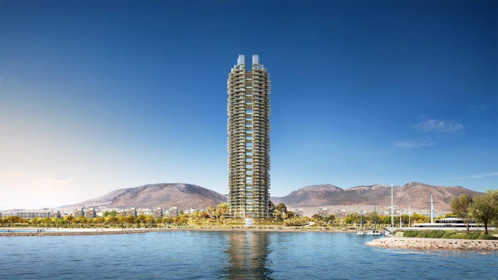 Tall residential tower rising from a tranquil waterfront, blending its form with the distant mountains.