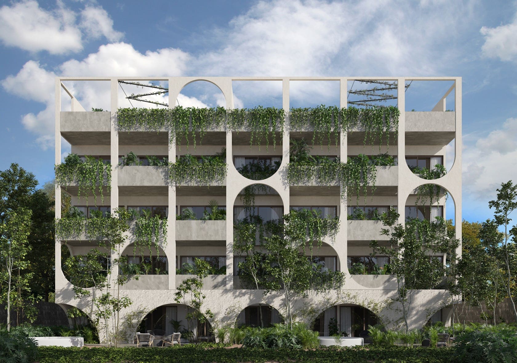 Vernal Tulum residential towers with biophilic architecture, featuring circular openings and cascading greenery against a tropical sky.